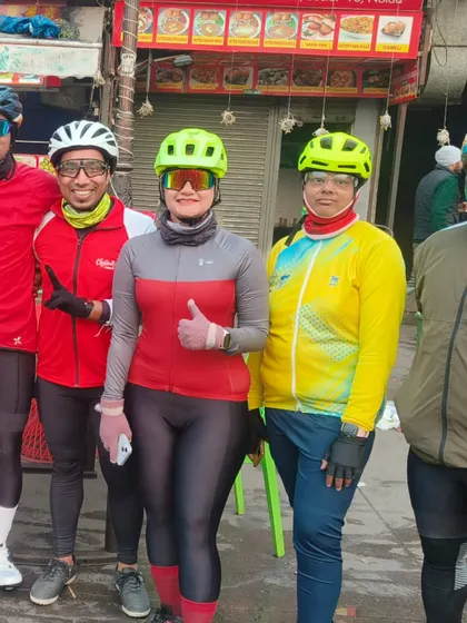 A group of riders, including a female member, posing at a dhaba during our Christmas ride. Our community is inclusive and welcoming.