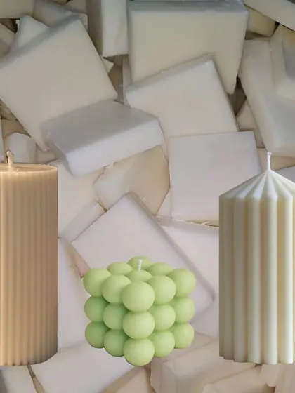 I offer a range of molded candle styles, including ribbed pillars and modern bubble shapes, all made from premium soy wax for a clean finish. This image shows the final products against the raw AA+ grade soy wax I use.