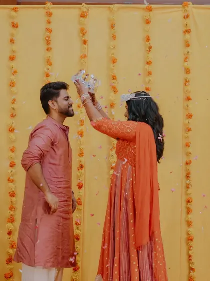 The bride playfully crowns her groom during their performance. It's these little interactions and personal touches that make an event truly unique.