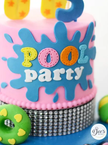 A close-up of the 'Pool Party' sign, with colorful, hand-cut letters.