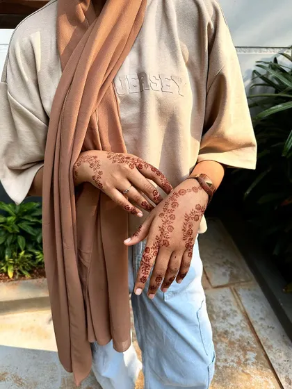 This is the same scattered floral design, showing how beautifully the natural henna stain develops into a warm, earthy tone on the skin.