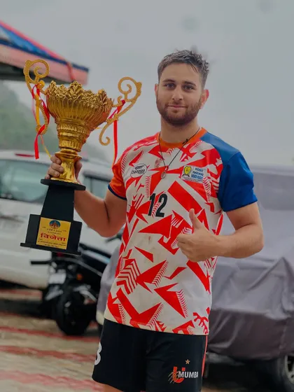 Academy player Irfan Mir with the winner's trophy after a successful tournament in Himachal.