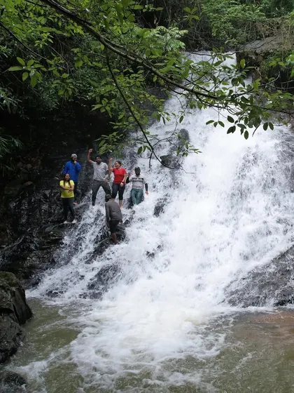 A fun, filmy pose at a waterfall, inspired by a popular song. We always have a good time and create fun memories.