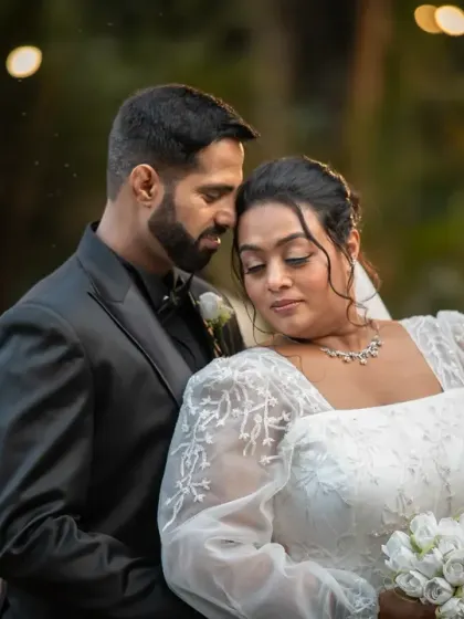 A quiet, romantic portrait of the couple after their ceremony. The soft evening light and their gentle embrace create a beautiful, emotional atmosphere.