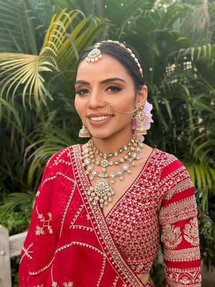 A closer portrait of the bride, highlighting the soft glam makeup that focuses on radiant skin and defined eyes, letting her natural beauty shine through.