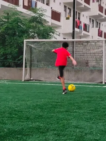 A player practices shooting at goal during our free camp in Noida. These camps are a great opportunity for kids to try out football and see if they enjoy it.