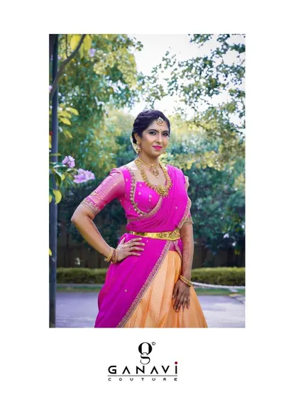 Shalini posing with confidence and grace in her custom half-saree. The colors and craftsmanship of the ensemble make it a standout piece for any celebration.