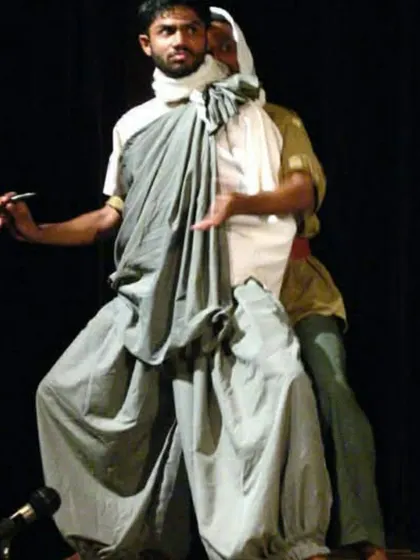 A moment of dramatic expression on stage. My experience as an actor taught me how to tell stories with my body, a skill that I now use to communicate the essence of each asana.