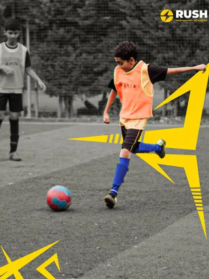 A focused player about to make a pass during a training exercise.