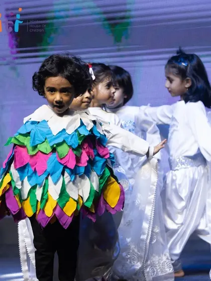 The bird and wind dancers perform together, creating a dynamic and beautiful stage picture.