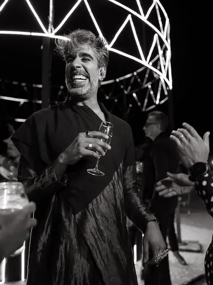 The joy of a great party, even in the middle of the desert. We create the atmosphere, and the guests bring the energy. This black and white shot captures the fun and laughter of the welcome dinner.
