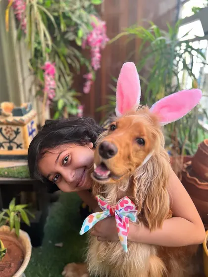 The perfect Easter portrait of a girl and her dog.