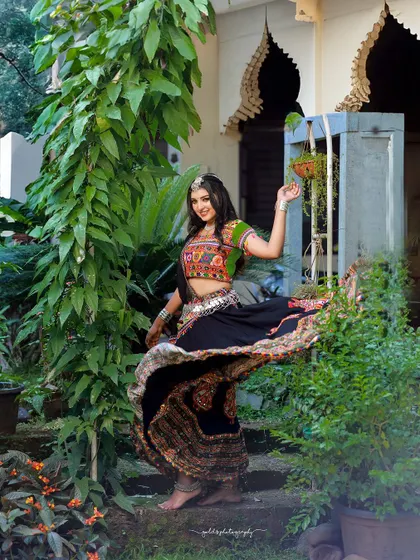A vibrant and energetic series celebrating Navratri. The model is dressed in colorful Garba attire, and the photos capture the festive spirit through dynamic poses and joyful expressions.