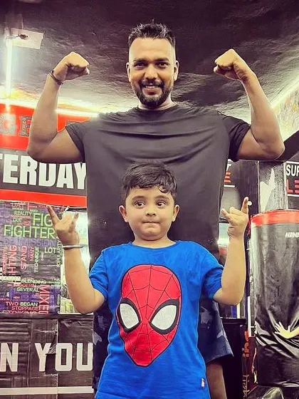 This little Spider-Man is also a fighter. Posing with a young student on his birthday.