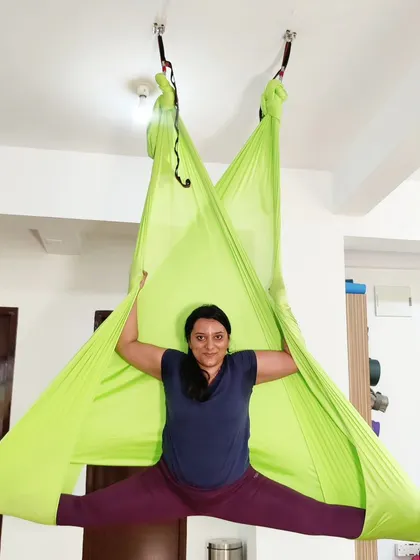 Another view of the supported split in the aerial hammock, highlighting the blend of strength and flexibility required.