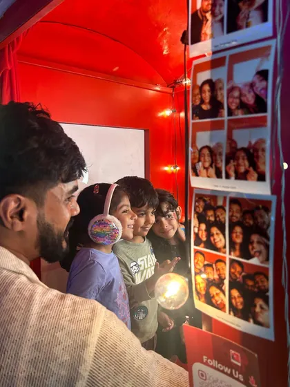 The excitement is real. I love this candid moment of kids watching their photo strips print out, their faces full of anticipation. Our booth provides a private, cozy space for families and friends to be themselves and capture memories they'll look back on for years.