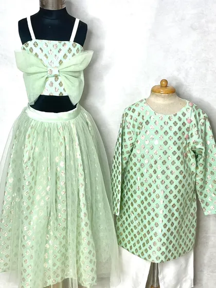 Soft and dreamy in our Mint Mira Lehenga. This set features a lehenga for the sister and a matching kurta for the brother, perfect for a summer wedding.