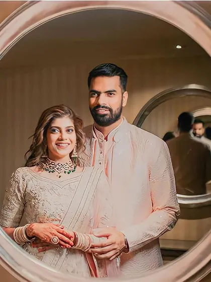 A modern-day portrait. This infinity mirror shot is a creative and stunning way to capture the couple's reflection and their endless love.
