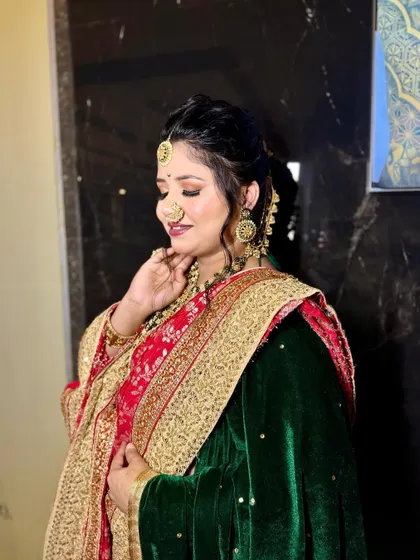 The complete look of a traditional bride, glowing with happiness. Her makeup is designed to be both glamorous and timeless.