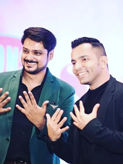 A fun, candid moment on stage. My goal is to be more than just an anchor; I aim to be a part of the celebration, sharing in the joy of the event.