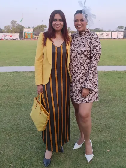With a friend at the polo match, enjoying the elegant day out. My presence at these events is both professional as a host and personal as an enthusiast, which helps me connect authentically with the guests.
