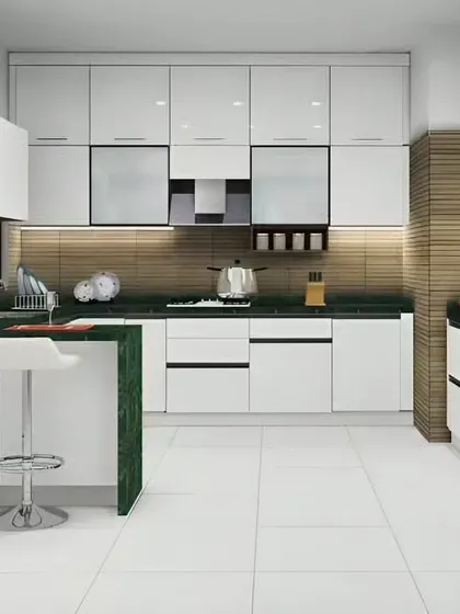 A striking kitchen design with a green marble breakfast bar. The contrast between the white cabinets and the bold green stone makes a powerful style statement.