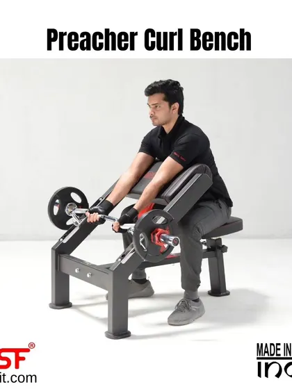 A user demonstrates proper form on the Preacher Curl Bench, with arms firmly planted on the pad.