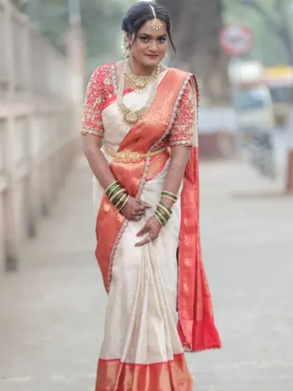 A full-length view of the pre-pleated saree on the Telugu bride. The pleats are uniform and the drape is secure, showcasing the crisp and clean finish that my pre-pleating service provides.