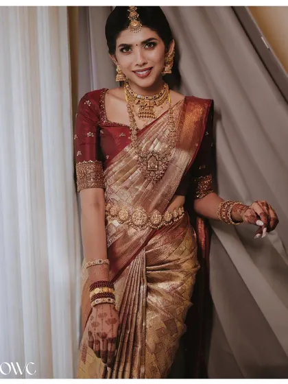 A beautiful full-length portrait of the bride, showcasing her complete traditional look from head to toe.