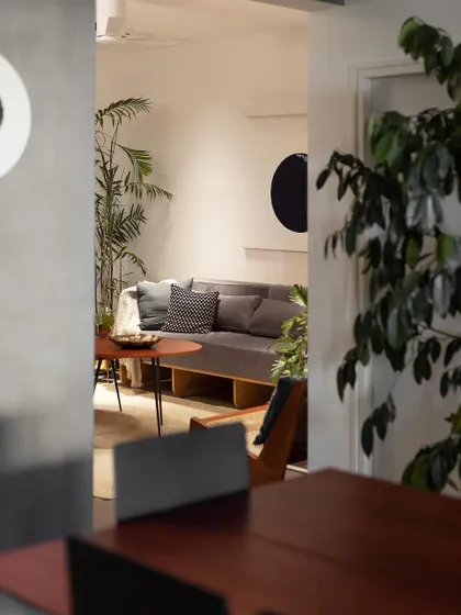 Peeking from one space into another in the 'Rustic Minimal' apartment. We design layouts that create interesting sightlines and a sense of discovery as you move through the home.