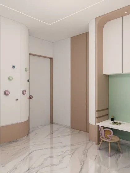 This kids' room features a playful and interactive wardrobe with colorful, oversized knobs that can be used for climbing. The design includes a built-in study nook with butterfly-themed chairs, making it a space that encourages both play and learning.