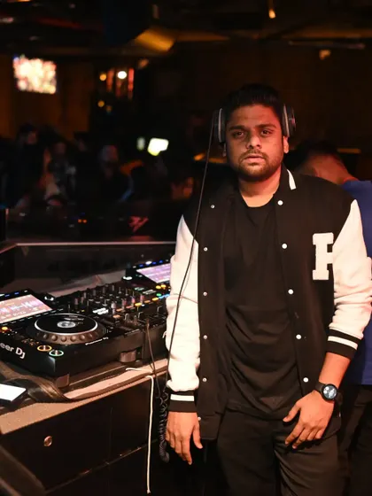 A moment of calm before the party kicks into high gear. Pictured here with my Pioneer DJ setup, ready for the night ahead.
