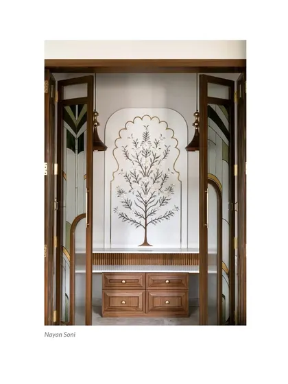 A press clipping of our custom Puja Room, recognized for its beautiful marble inlay work and artisanal glass and wood shutters.