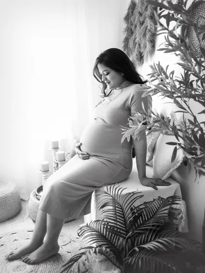 A serene, pensive portrait in black and white. This image, taken in my boho studio, shows how monochrome can create a sense of peace and timelessness.