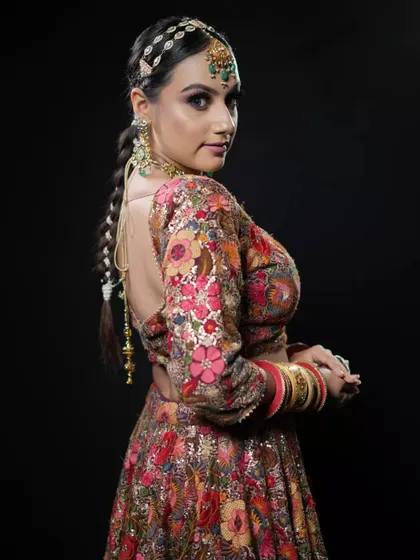 Another angle of the editorial braided ponytail, highlighting the clean parting and the way the braid falls elegantly down the back.
