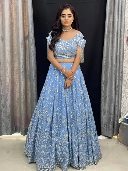 A full-length view of the powder blue lehenga, a chic and modern choice for a bridesmaid or wedding guest.