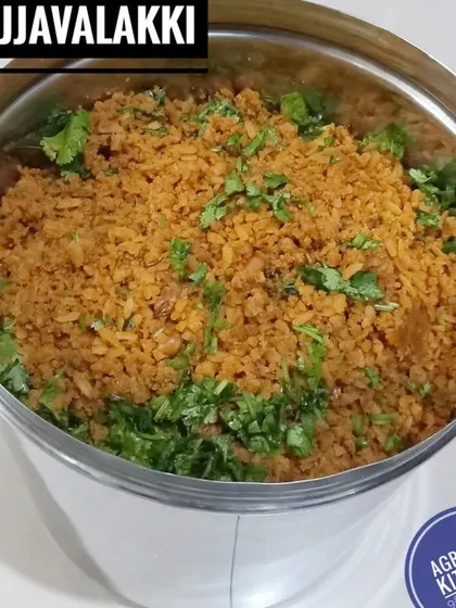 Today's hot breakfast, Gojjavalakki. This tangy and spicy flattened rice dish is a Karnataka delicacy, garnished with fresh coriander before serving.