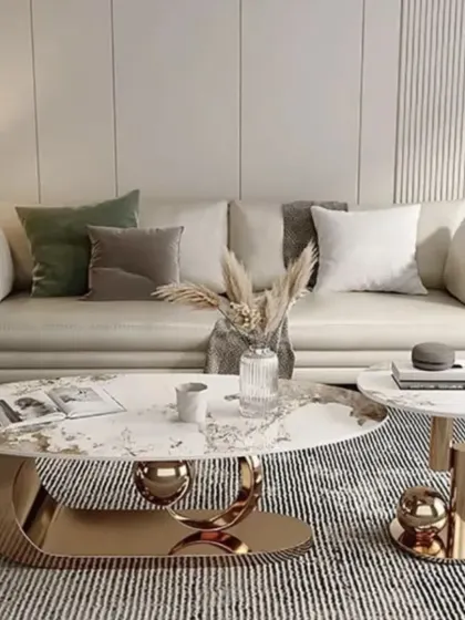 This glamorous center table features a gold-plated crescent base and a marble-patterned top. The matching side table continues the theme, adding a touch of modern luxury to the living space.