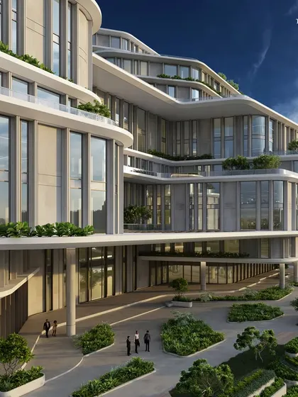 This view highlights the building's horizontal connectivity and vertical development. The design blends fluid forms with structured blocks, creating spaces that breathe creativity and efficiency.