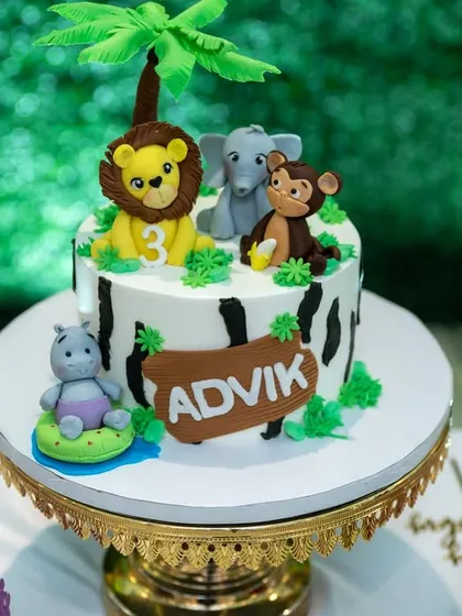 A fun jungle animal-themed cake for Advik's third birthday. Our detail shots preserve the memory of all the creative elements of your party.