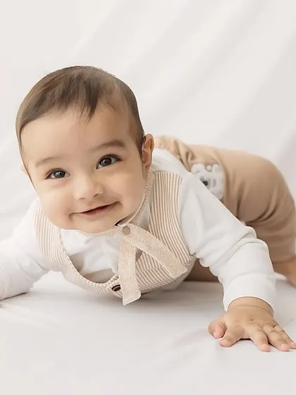 Almost on the move! This crawling pose captures the energy and excitement of a six-month-old baby.
