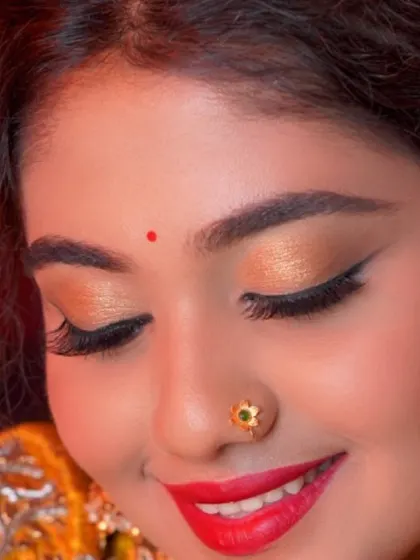 A close-up on the eyes. This shot showcases the beautiful blend of golden eyeshadow and sharp winged liner, a key part of my signature festive looks.