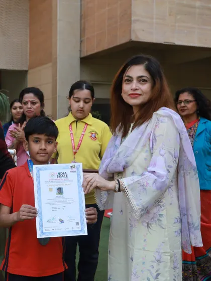 Our Principal awards a medal and certificate to a victorious student at the Annual Sports Day. We believe in recognizing and celebrating the achievements of our young athletes to motivate them to continue striving for excellence.