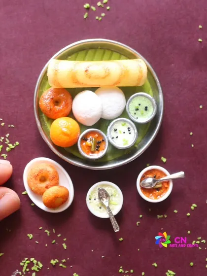 A close-up of a South Indian breakfast thali, complete with idli, vada, dosa, and kesari. I love capturing the warmth and comfort of these familiar dishes in my miniature art.