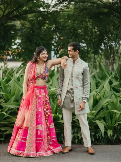 A couple looking relaxed and happy, posing together during one of their pre-wedding functions.