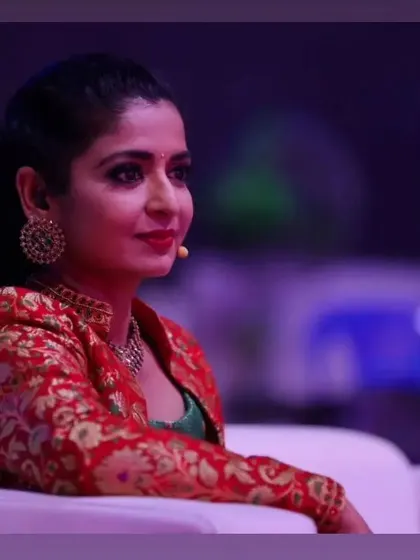 A candid shot of the talented Sushma K. Rao during a show. The makeup is designed to look polished and professional from every angle, whether on stage or sitting as part of the audience.