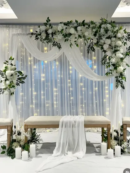 I design clean and elegant setups perfect for a Nikkah, Roka, or minimalist wedding. This all-white theme with soft lighting and delicate florals creates a timeless and graceful look.