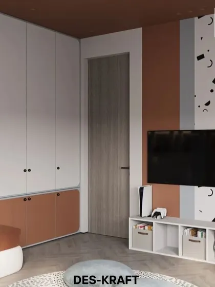 The entertainment and storage unit is designed to be both functional and fun, with open cubbies for easy access to toys and a wall-mounted TV.