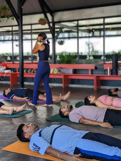 A moment of rest in Savasana, with a puppy assistant making sure everyone is relaxed. These sessions are just as healing for us as they are for the pups.