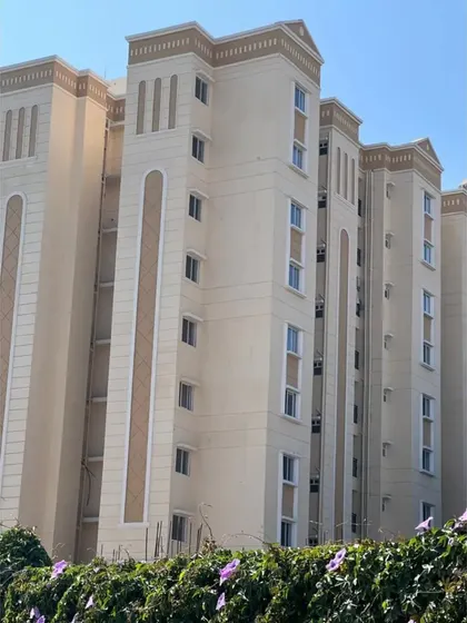 A photo of the nearly completed Love Home Jodhpur building. This image shows how the architectural details and color scheme from the render have been faithfully executed in the final construction.